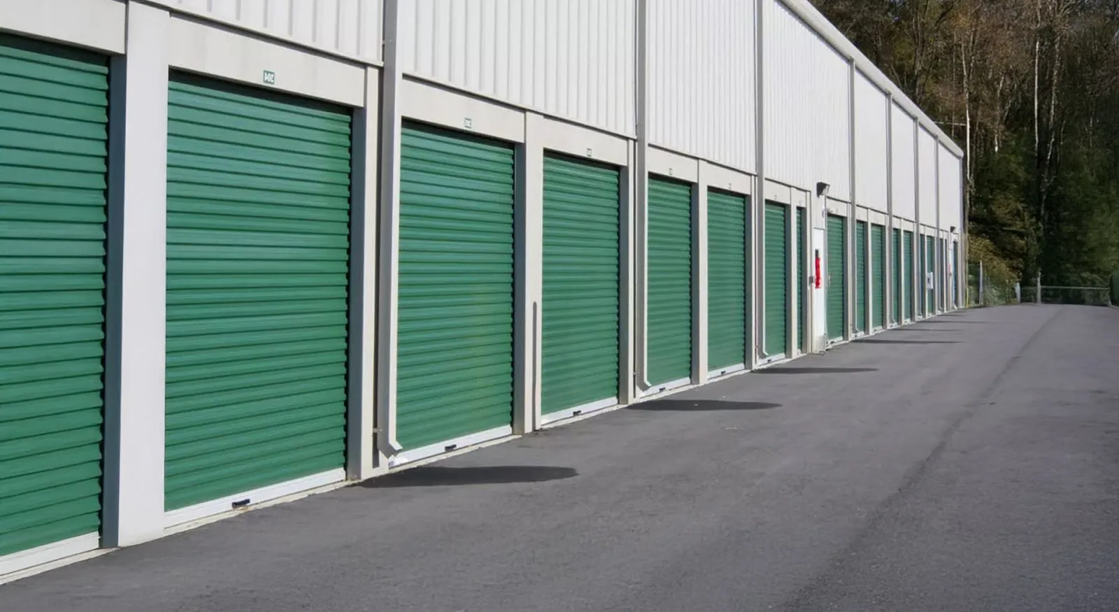 Row of solid roller shutters on commercial units