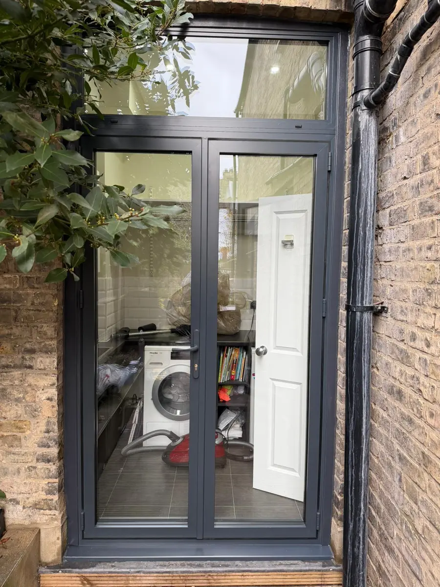 Glazed aluminium commercial side-entrance door installed in London by Range Shop Fronts