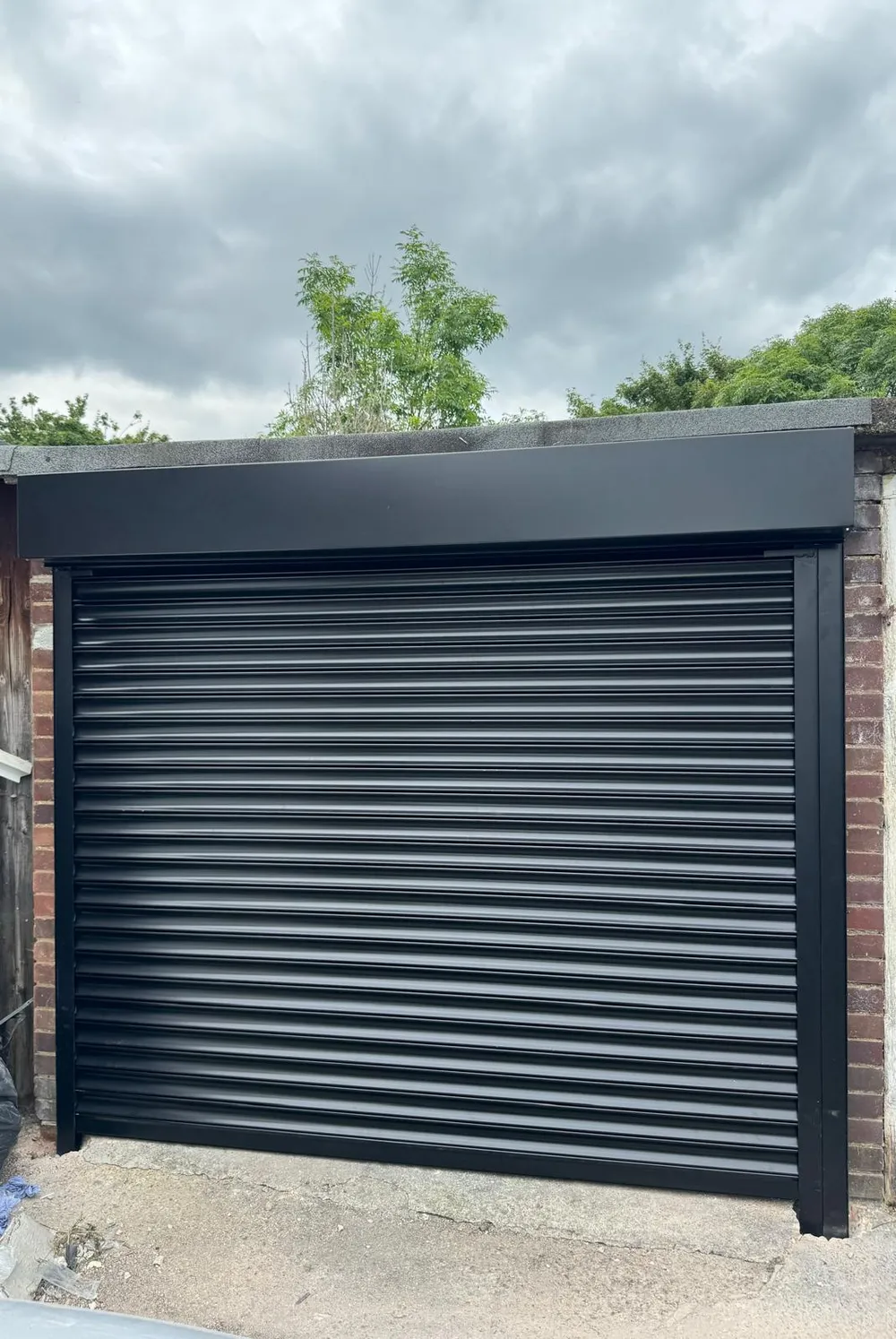 Close-up of insulated aluminium slats on a black roller garage door