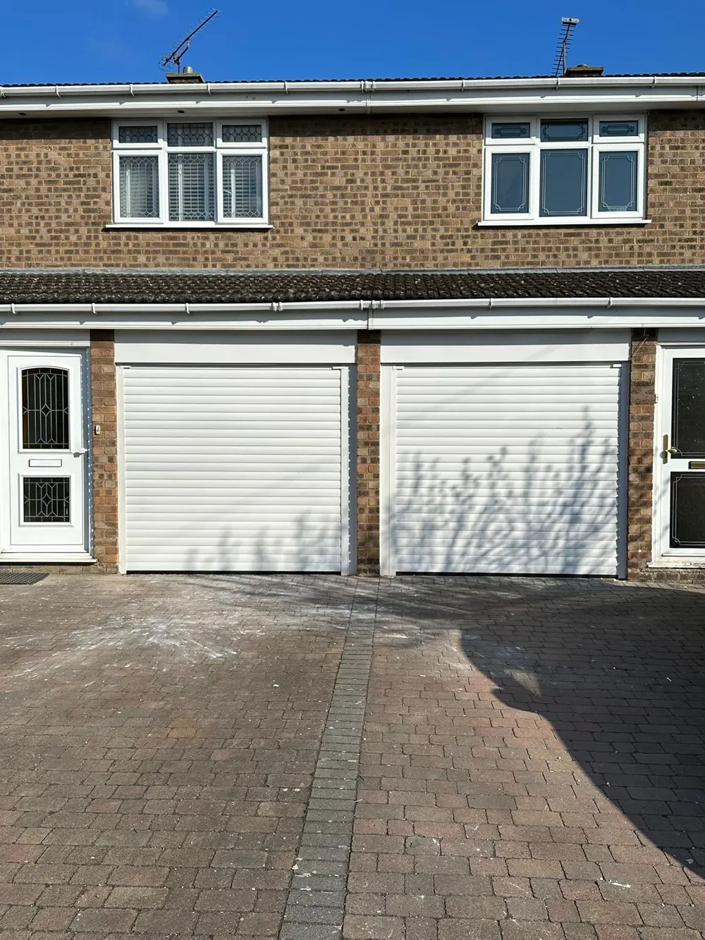 White double garage doors on a London home