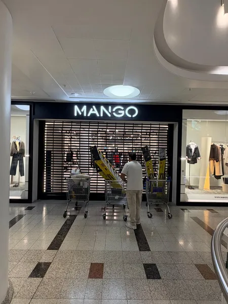 Perforated security roller shutter installed for the Mango store in London by Range Shop Fronts