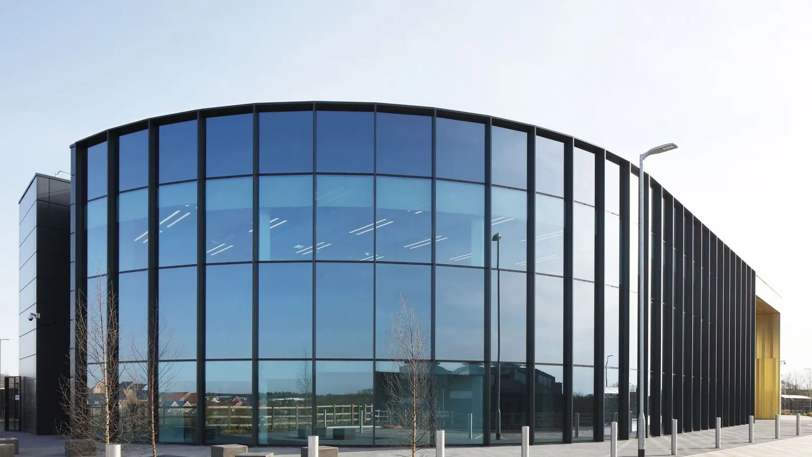 Curved curtain wall glazing on a modern office building