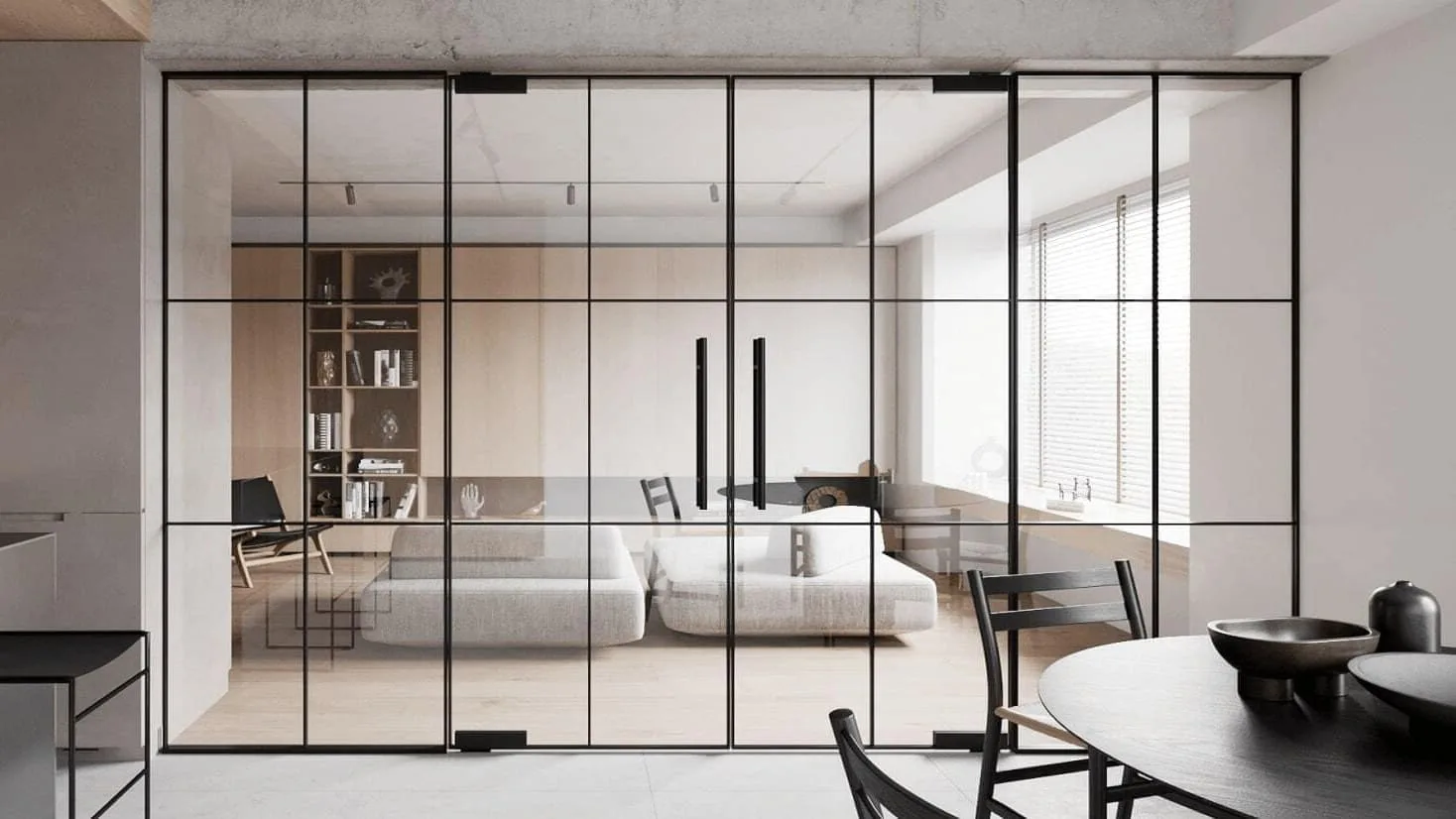 Black-framed glass partition in a modern open-plan interior