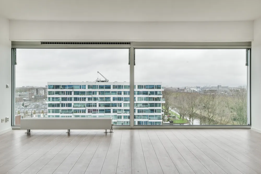 Aluminium French windows opening onto a balcony